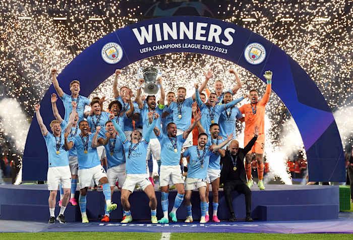 Manchester City's players pictured celebrating with the European Cup trophy after winning the 2023 Champions League final